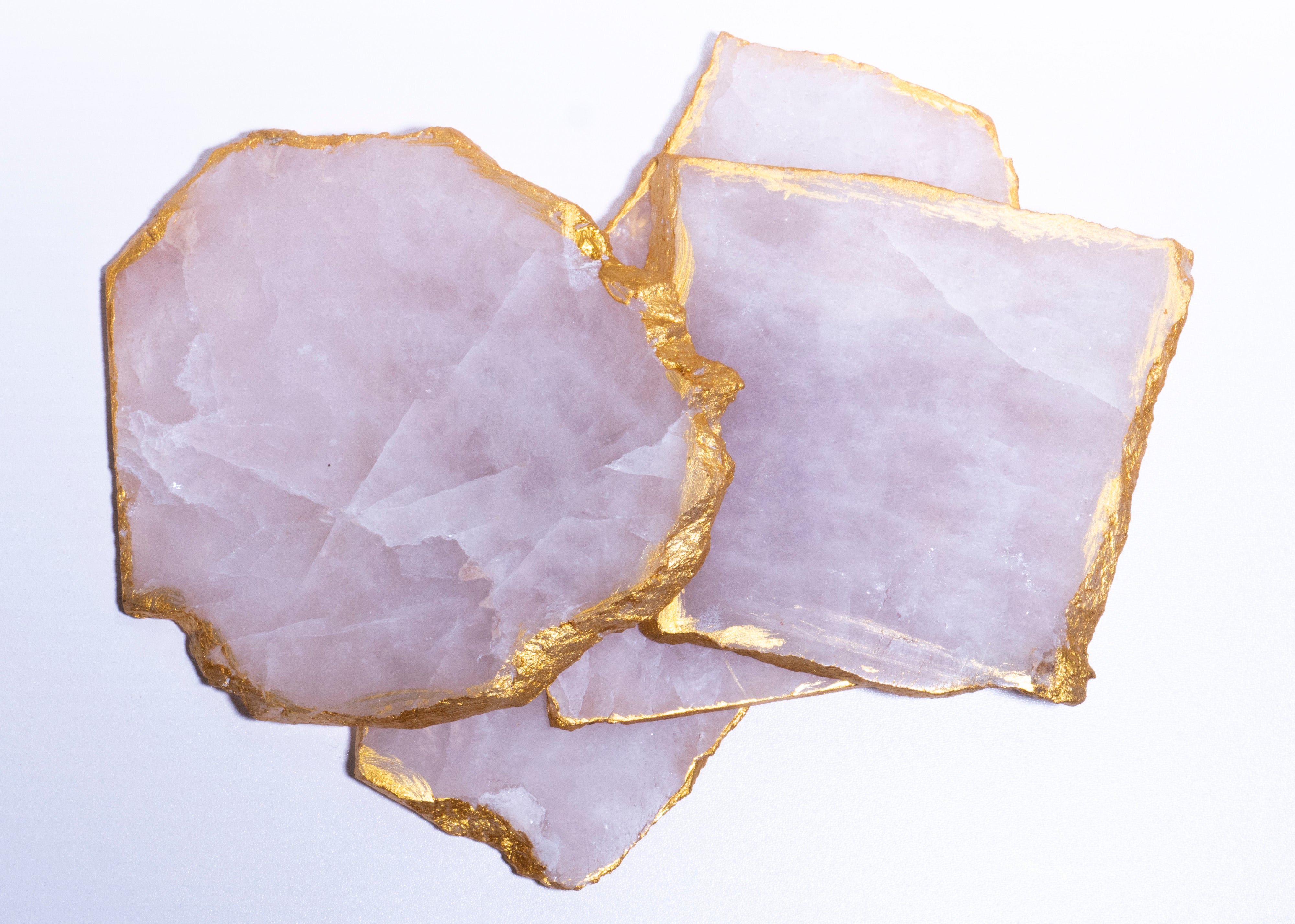 Trimmed in electroplated gold, rose quartz coasters exude luxury.